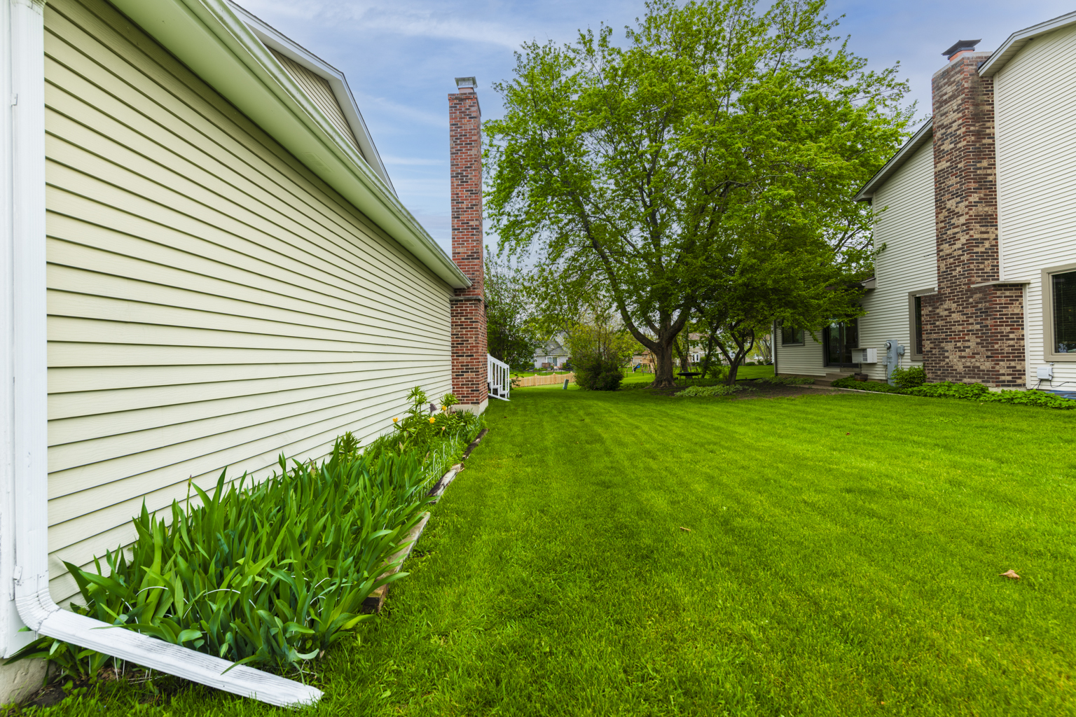 1494 Applegate Drive Naperville, IL 60565 - Photo 33 of 35 a view of a backyard with plants and large trees