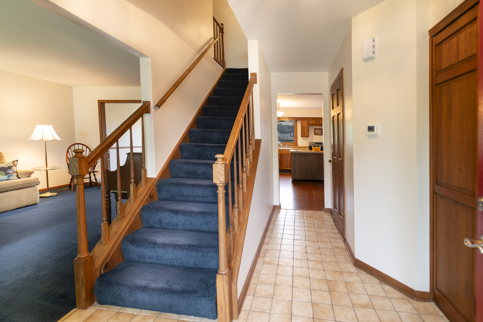 1494 Applegate Drive Naperville, IL 60565 - Photo 5 of 35 a view of a hallway with wooden floor and staircase