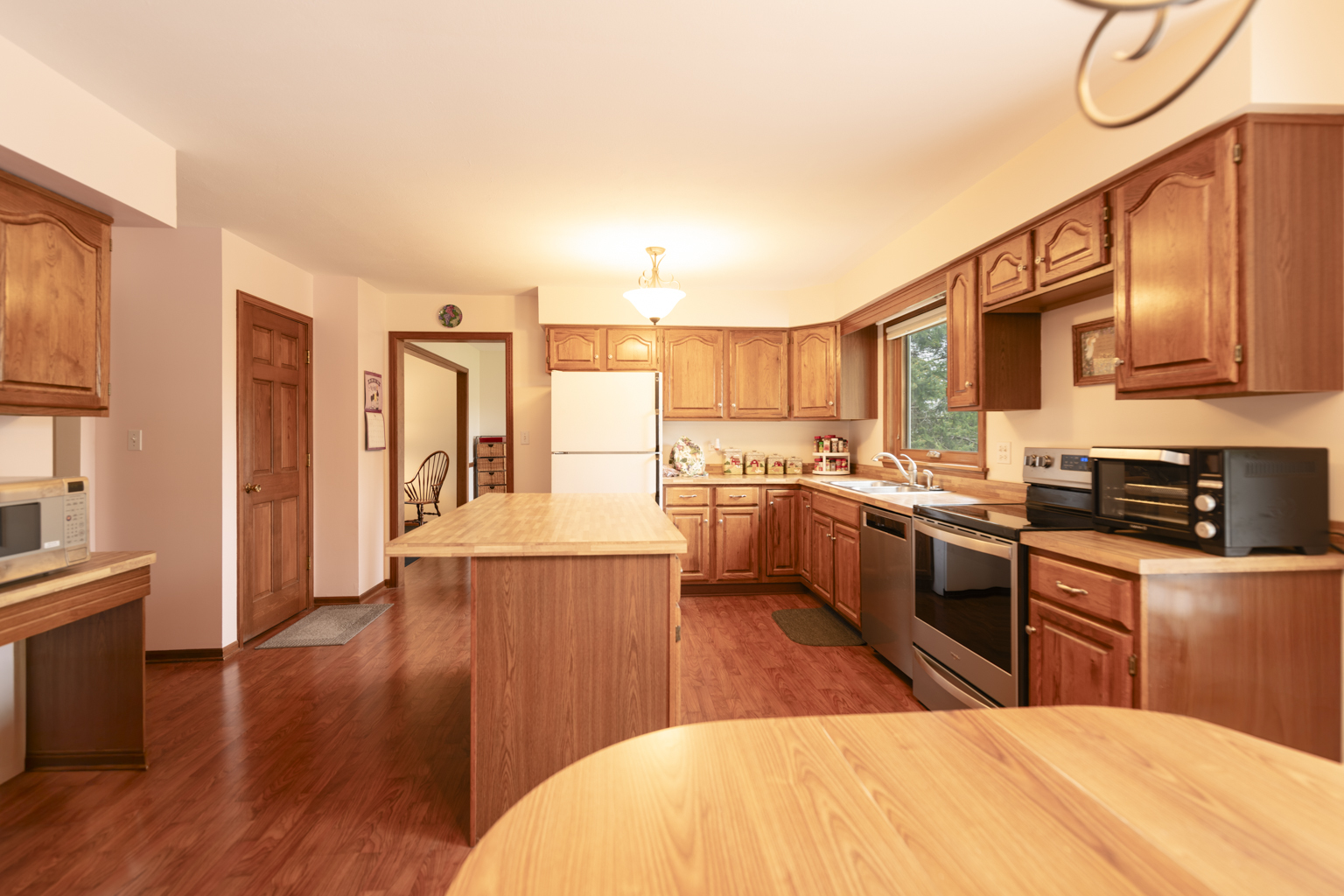 1494 Applegate Drive Naperville, IL 60565 - Photo 10 of 35 a kitchen with stainless steel appliances kitchen island granite countertop a stove a sink and a refrigerator