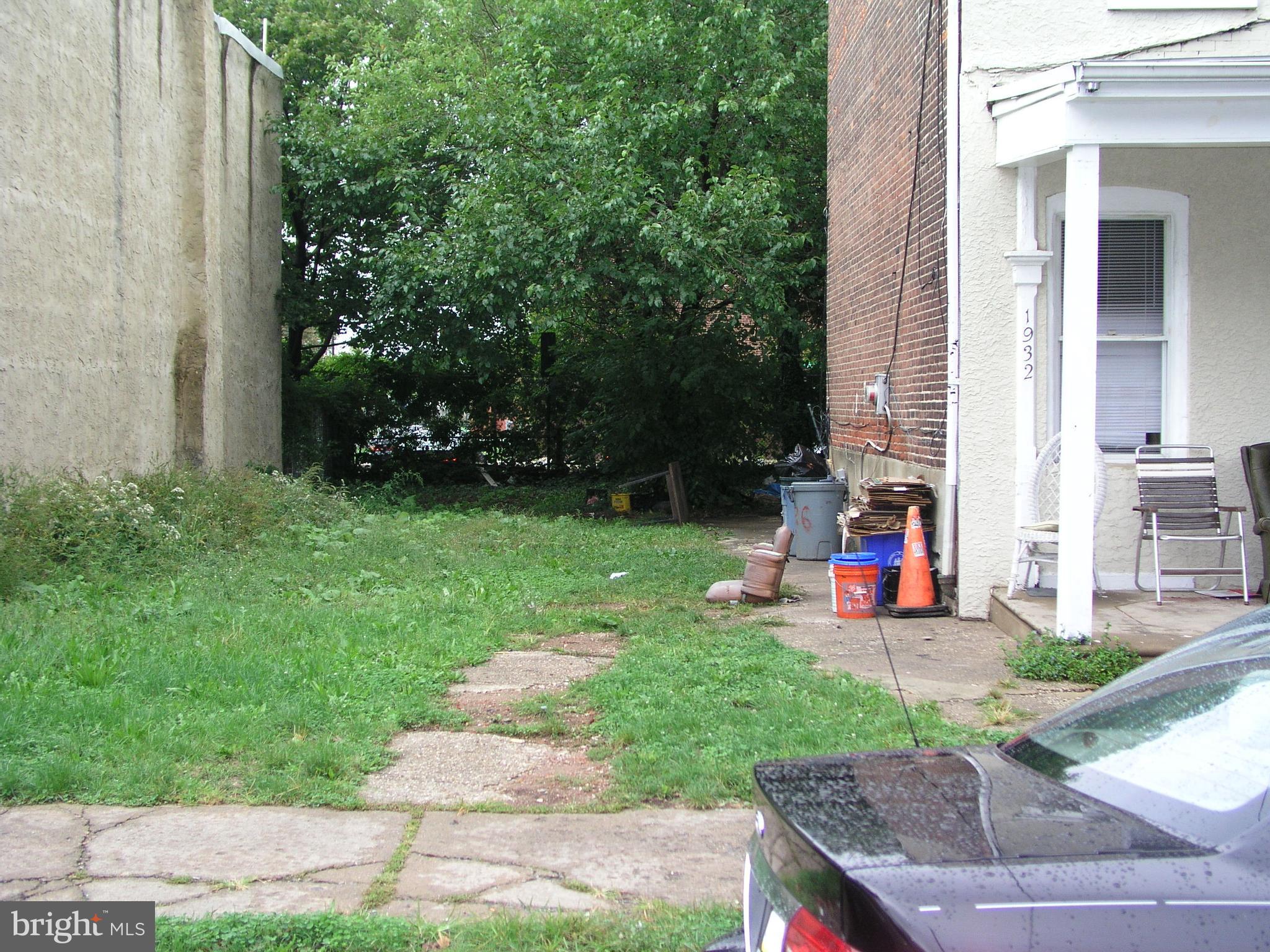 a view of a backyard with sitting area and slide