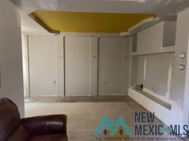 2415 Northwest Oro Road Albuquerque, NM 87107 - Photo 3 of 9 Recessed ceiling feature with a yellow-painted panel