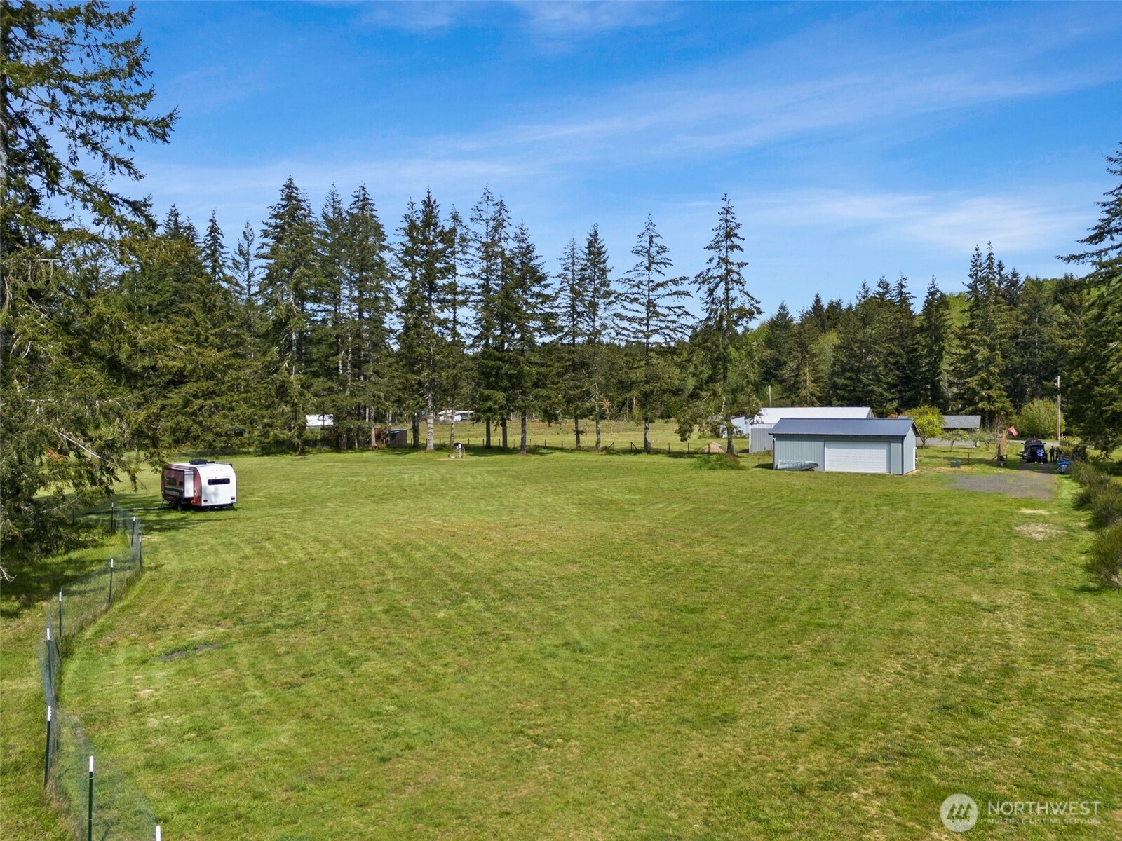 1982 West Ford Loop Road Elma, WA 98541 - Photo 11 of 15 a front view of a house with a yard