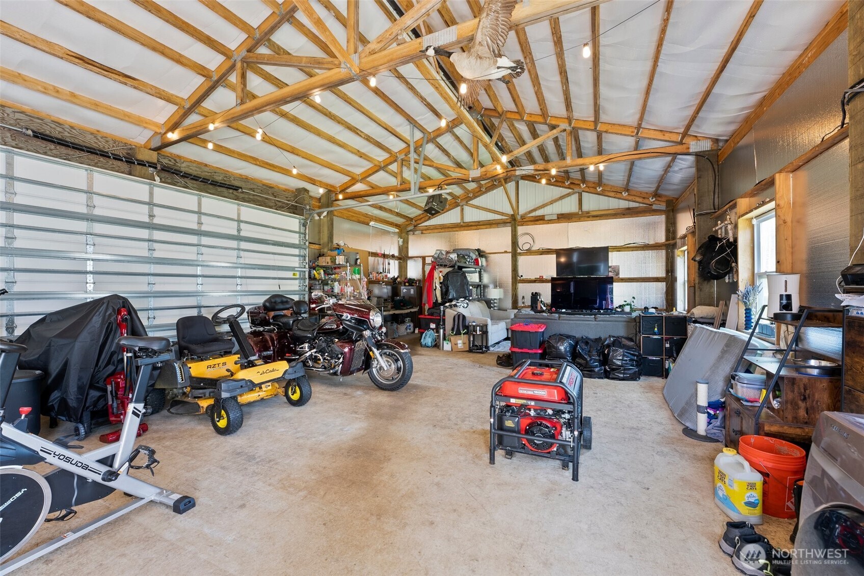 1982 West Ford Loop Road Elma, WA 98541 - Photo 4 of 15 a view of a garage with a car and a bike