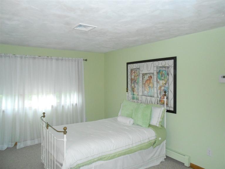 9 Bunker Circle Sandwich, MA 02563 - Photo 14 of 19 a bedroom with a bed and hallway