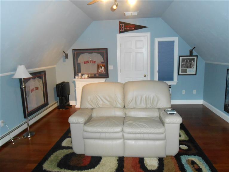 9 Bunker Circle Sandwich, MA 02563 - Photo 16 of 19 a bedroom with a bed and wooden floor