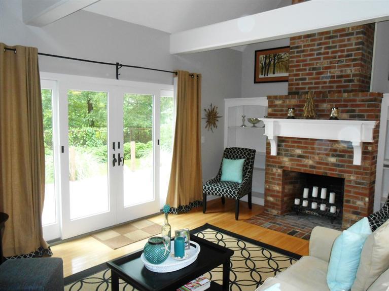 9 Bunker Circle Sandwich, MA 02563 - Photo 2 of 19 a living room with furniture and a fireplace
