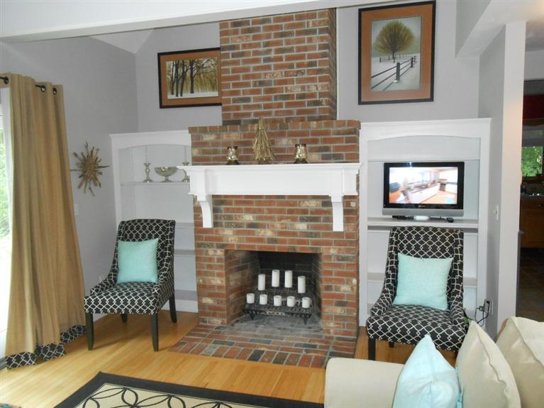 9 Bunker Circle Sandwich, MA 02563 - Photo 3 of 19 a living room with furniture and a fireplace