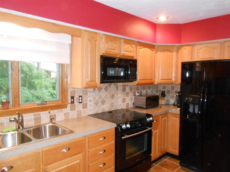 9 Bunker Circle Sandwich, MA 02563 - Photo 6 of 19 a kitchen with a sink a stove and a refrigerator