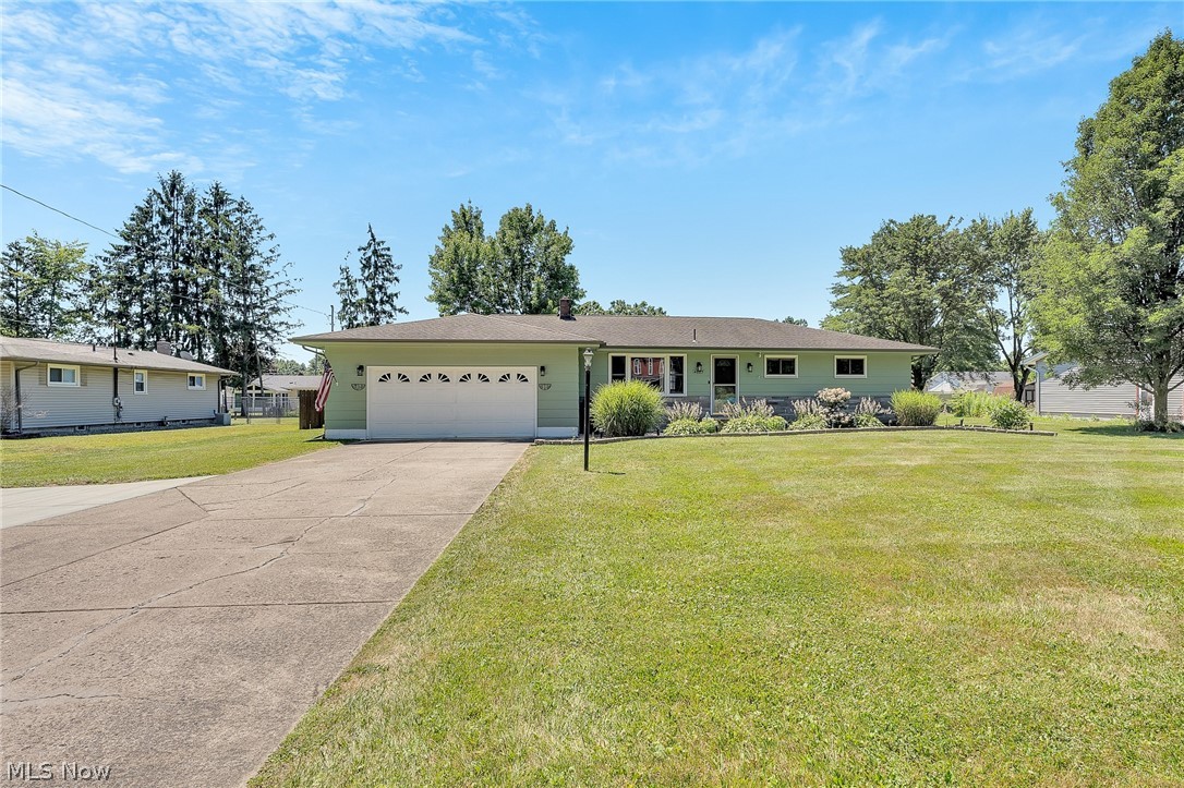 4685 New Road Youngstown, OH 44515 - Photo 1 of 37 Single story home featuring a garage and a front yard