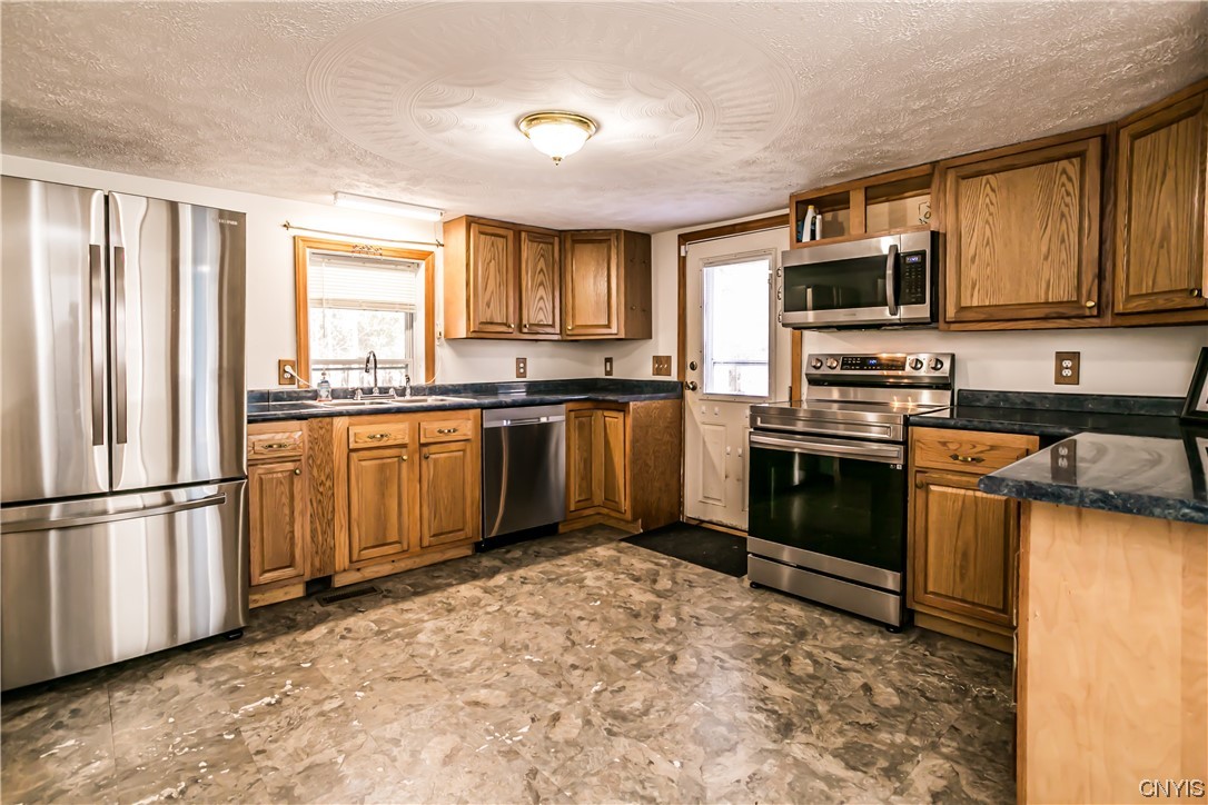 614 Fitch Street Oneida, NY 13421 - Photo 5 of 15 Bright kitchen w/ SS appliances