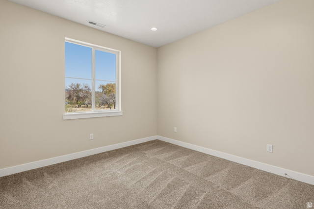 157 West 100 South Joseph, UT 84739 - Photo 19 of 30 Unfurnished room with light colored carpet and recessed lighting