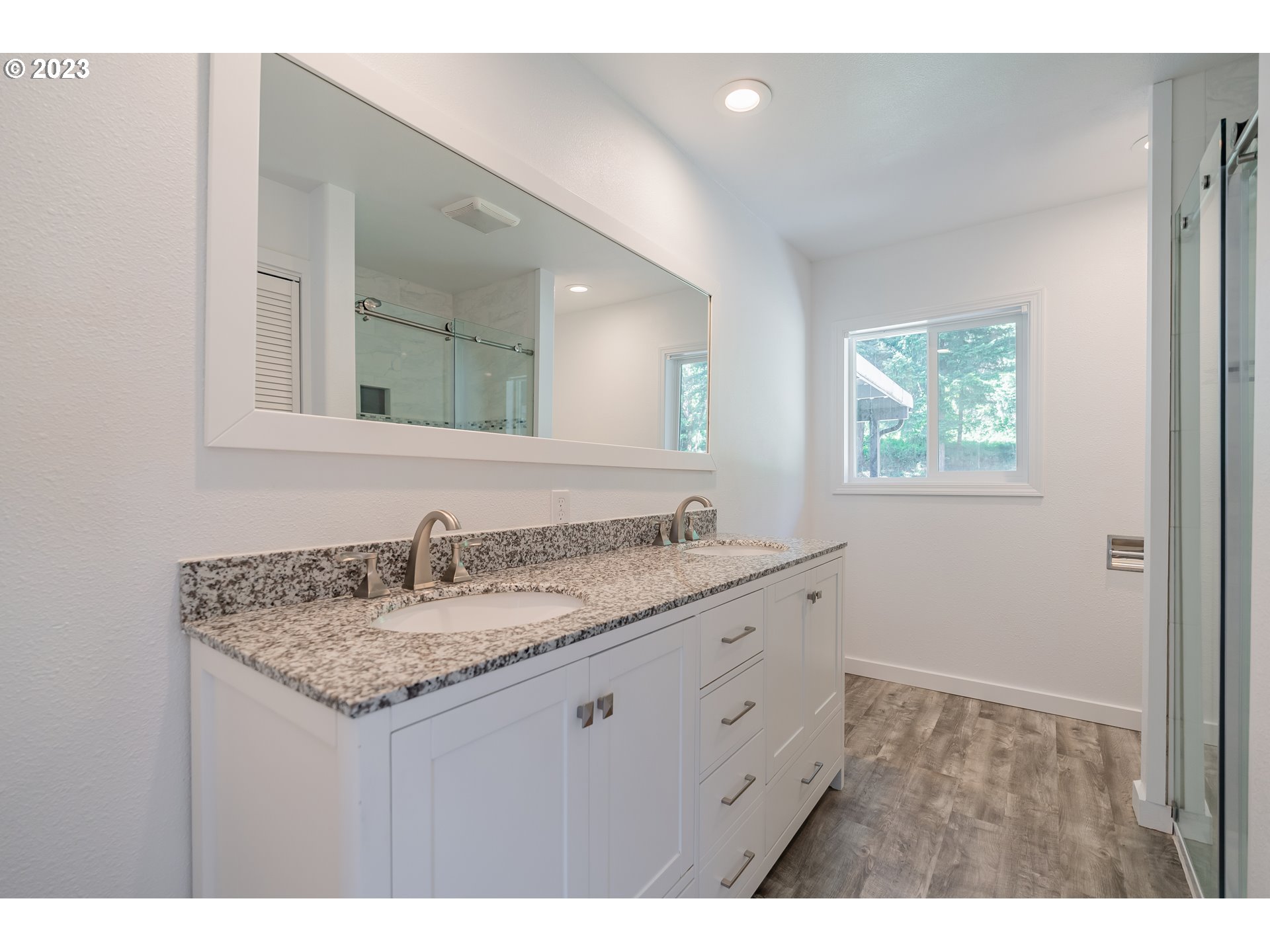 721 Northwest Gropper Road Stevenson, WA 98648 - Photo 23 of 45 a bathroom with a granite countertop sink and a mirror