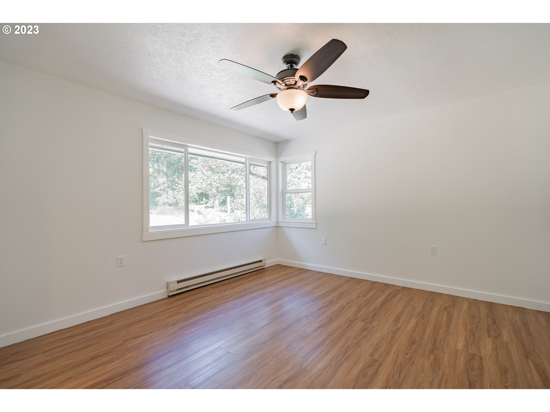 721 Northwest Gropper Road Stevenson, WA 98648 - Photo 33 of 45 a view of an empty room with wooden floor and a window
