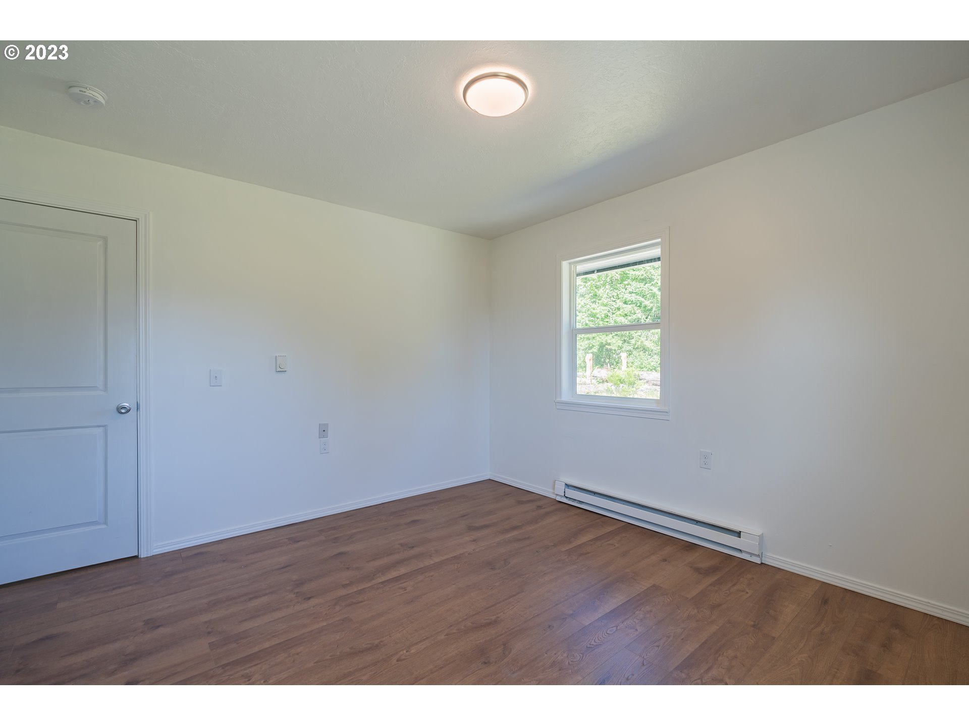 721 Northwest Gropper Road Stevenson, WA 98648 - Photo 39 of 45 a view of an empty room with wooden floor