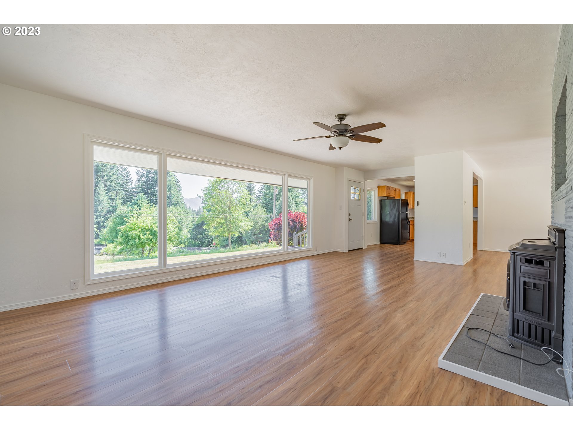 721 Northwest Gropper Road Stevenson, WA 98648 - Photo 8 of 45 a view of an empty room with a window and wooden floor