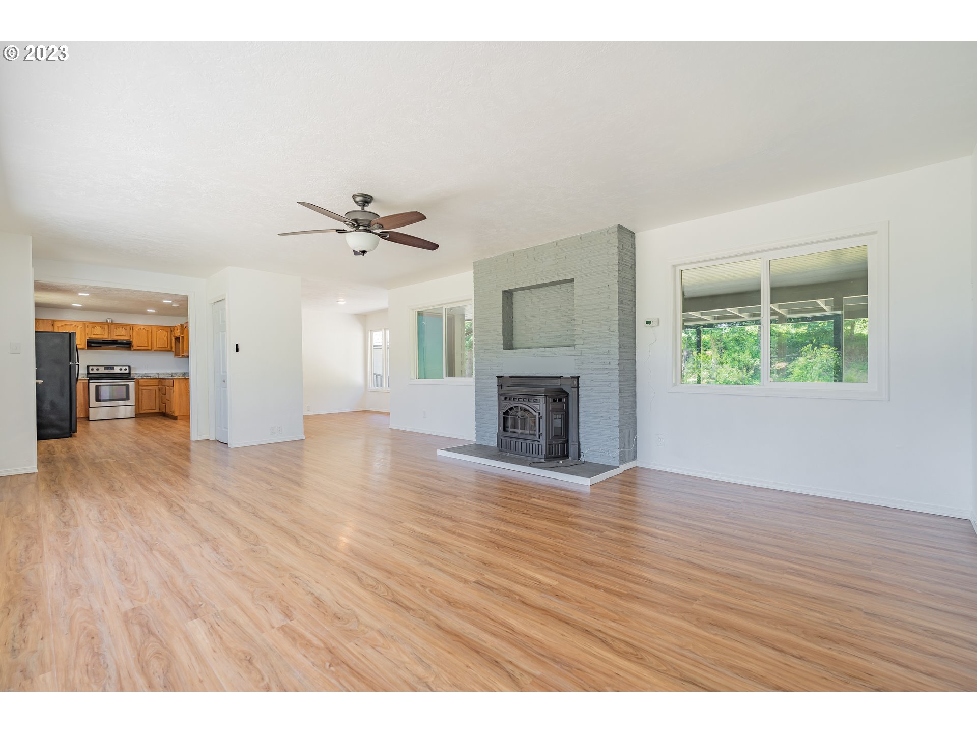 721 Northwest Gropper Road Stevenson, WA 98648 - Photo 9 of 45 a view of an empty room with wooden floor and a window
