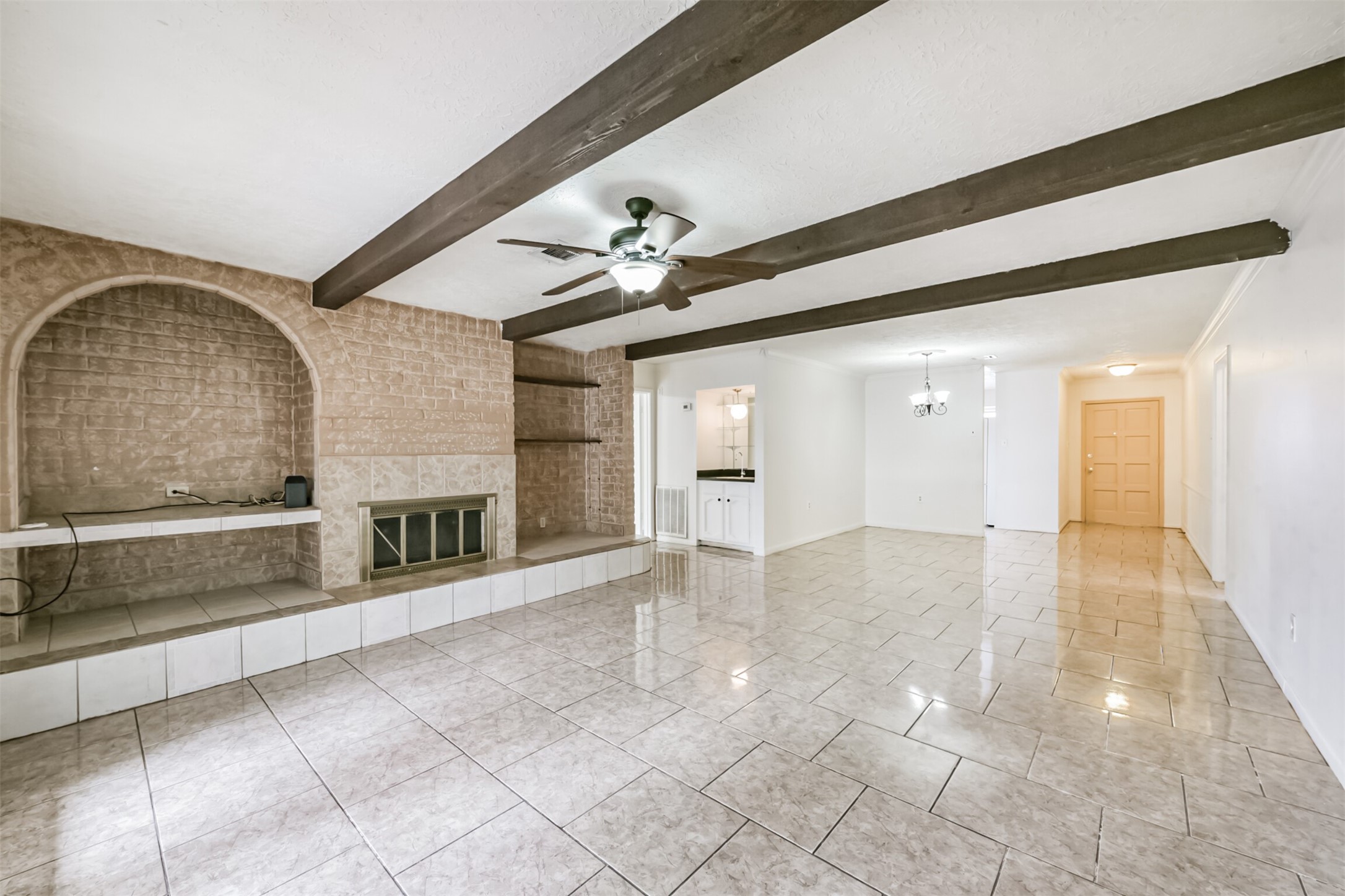 a view of an empty room with a fireplace