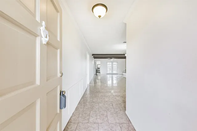 a view of a hallway with front door