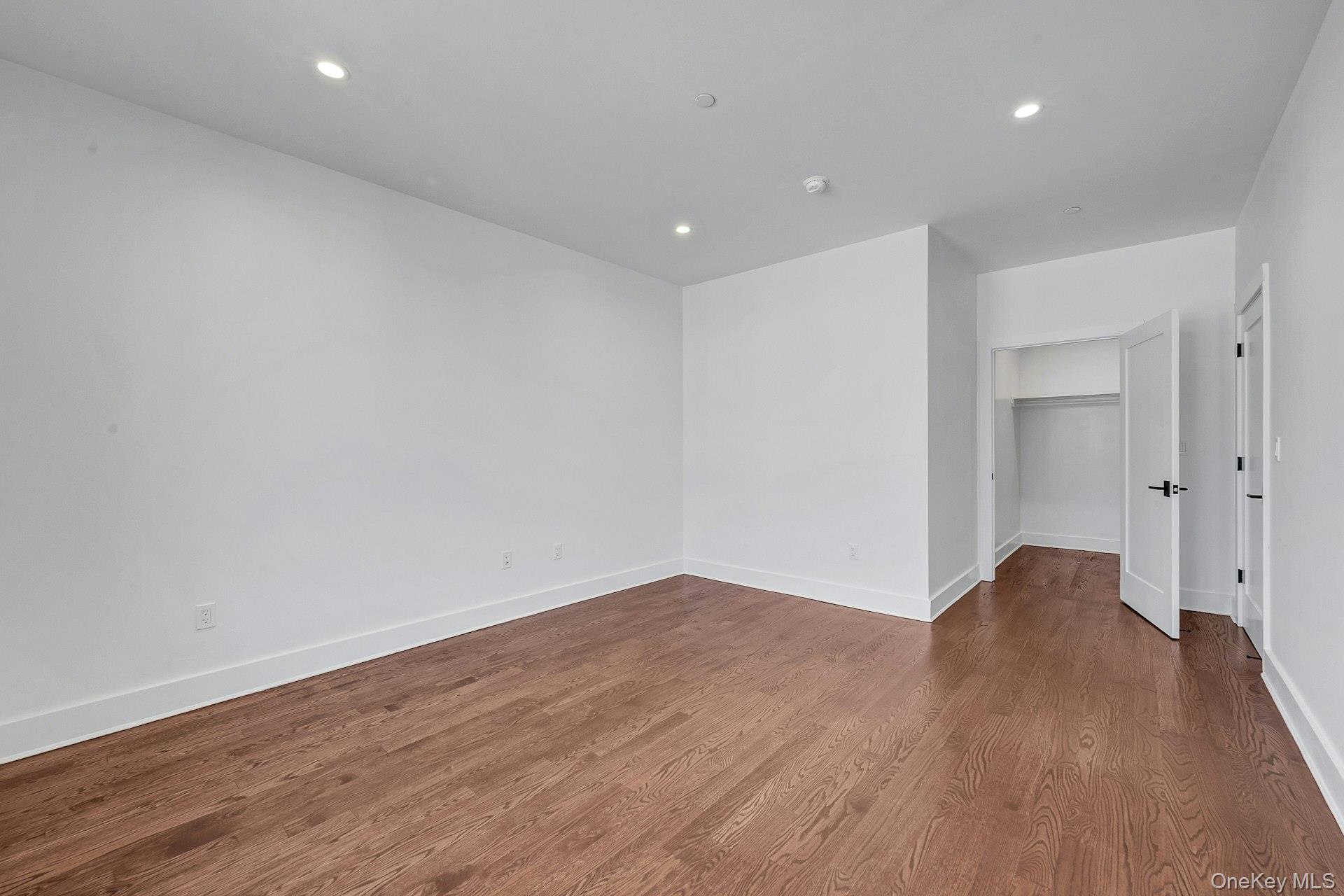 291 Main Street, Unit 1C Eastchester, NY 10709 - Photo 7 of 14 a view of empty room with wooden floor