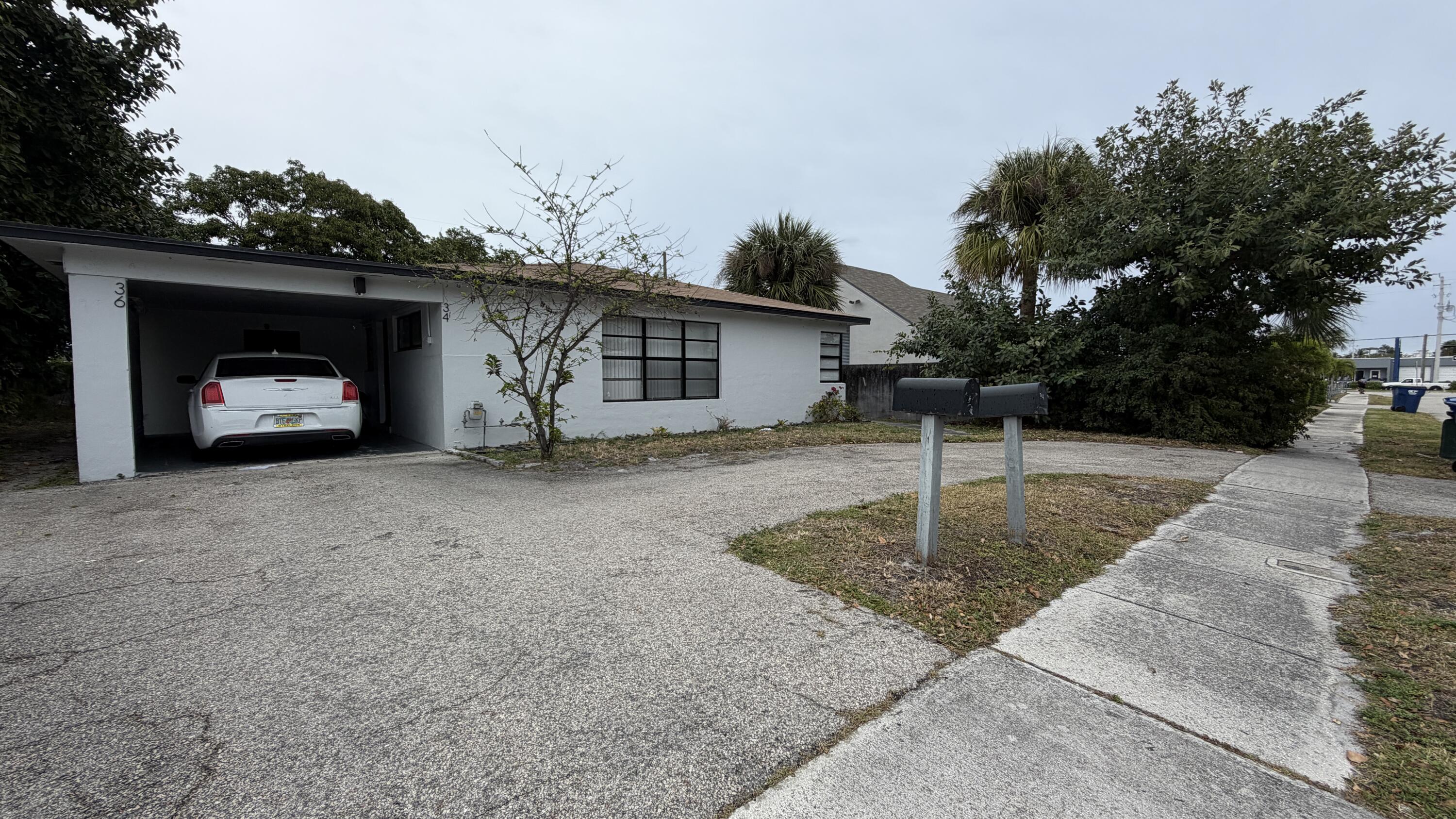 34 West 34th Street Riviera Beach, FL 33404 - Photo 1 of 10 Front Unit