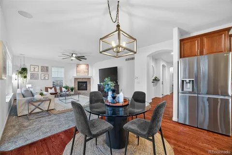 a view of a dining room with furniture window and wooden floor