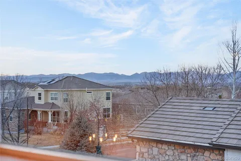 a view of a house with a yard and balcony