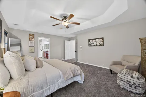 a bedroom with a bed and a couch