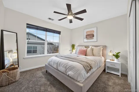 a bedroom with bed and a window