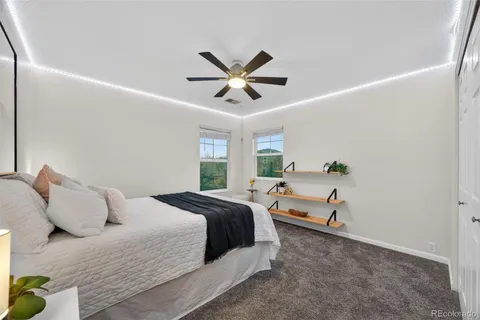 a bedroom with a bed and window