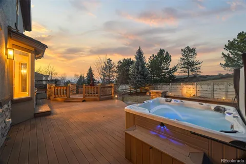 a view of a swimming pool with seating area and furniture