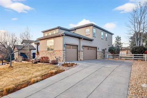 a view of a house with a snow on the road