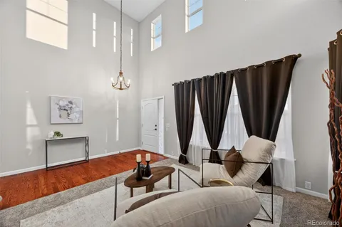 a view of room with furniture and a window