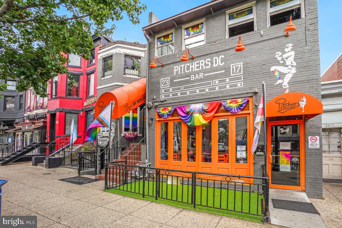 1954 Columbia Road Northwest, Unit 308 Washington, DC 20009 - Photo 46 of 51 a front view of multi story residential apartment building with retail shops