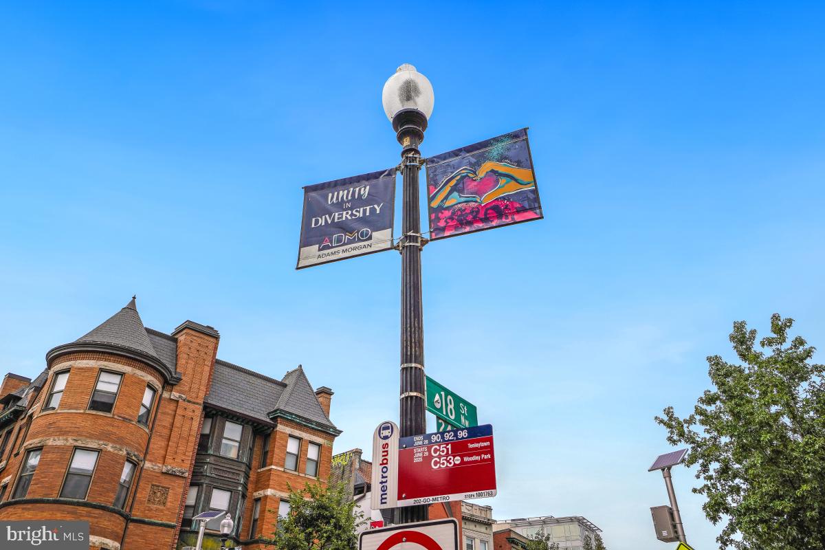 1954 Columbia Road Northwest, Unit 308 Washington, DC 20009 - Photo 47 of 51 a street sign on a pole on a street
