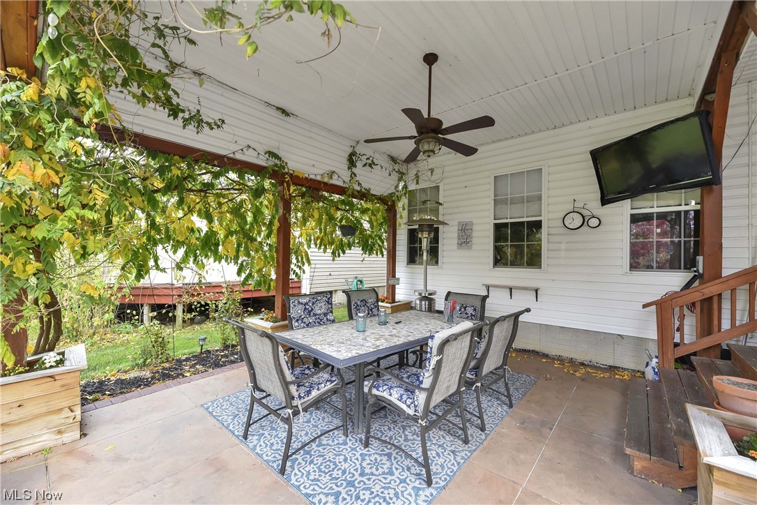 View of patio featuring ceiling fan