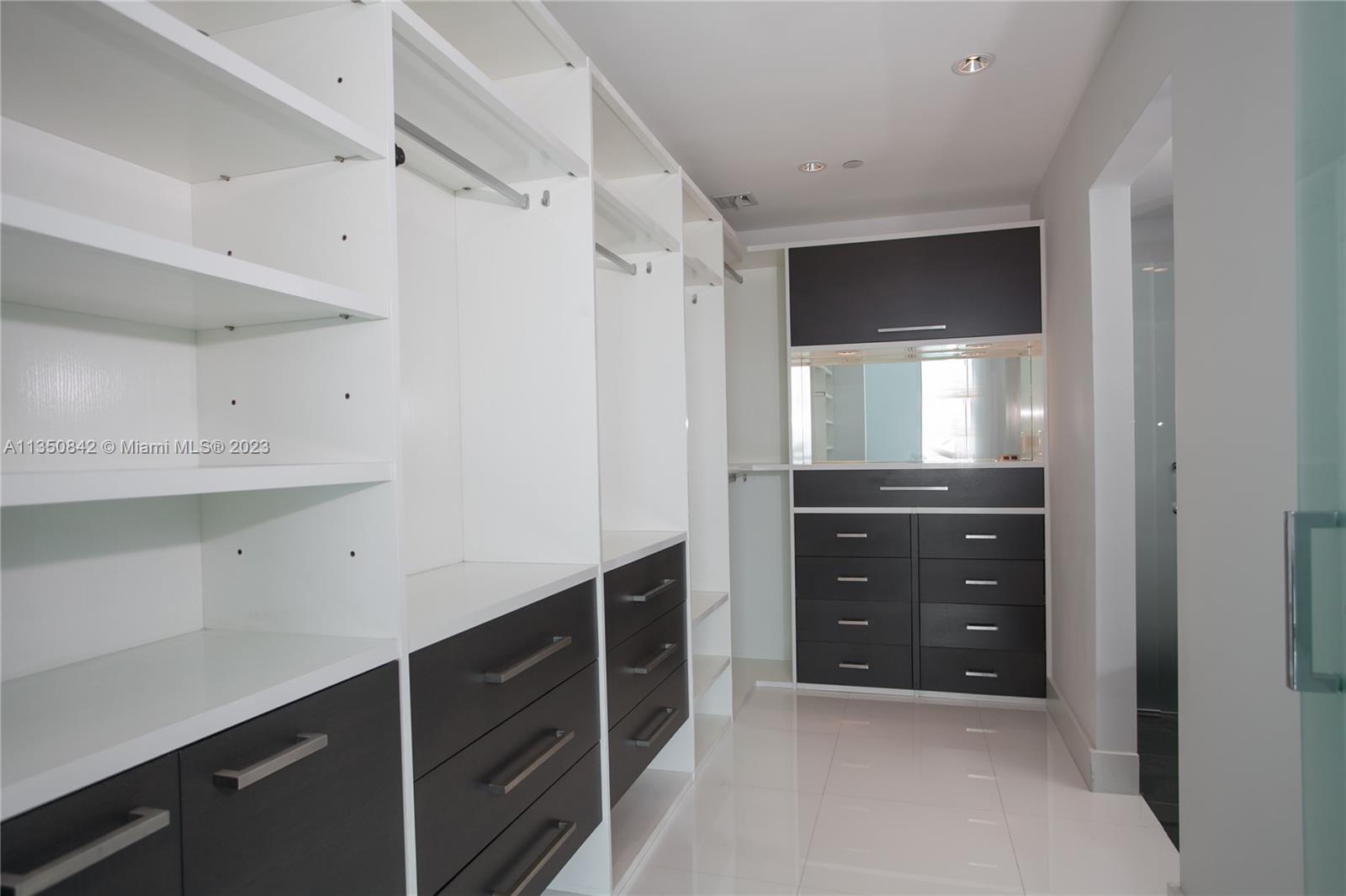 900 Biscayne Boulevard, Unit 4804 Miami, FL 33132 - Photo 12 of 17 a room with cabinets and wooden floor