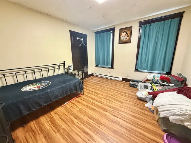 a view of a livingroom with furniture and staircase
