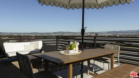a view of a terrace with furniture