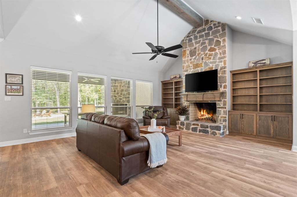 Tbd Tbd Anchor Point Quinlan, TX 75474 - Photo 5 of 40 a living room with furniture a fireplace and a flat screen tv