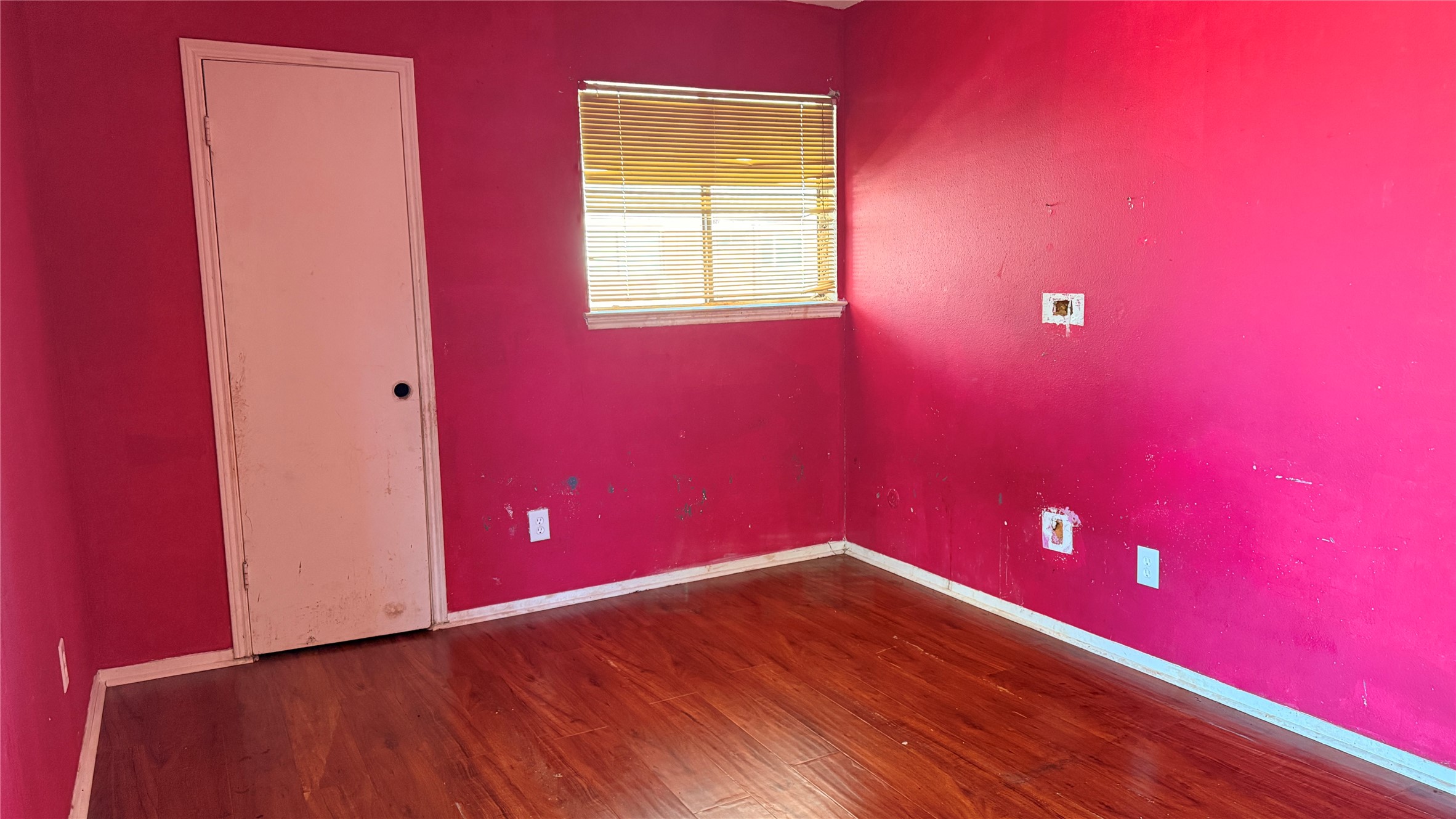 9010 Imogene Street, Unit A Houston, TX 77036 - Photo 4 of 8 a view of empty room with wooden floor and fan