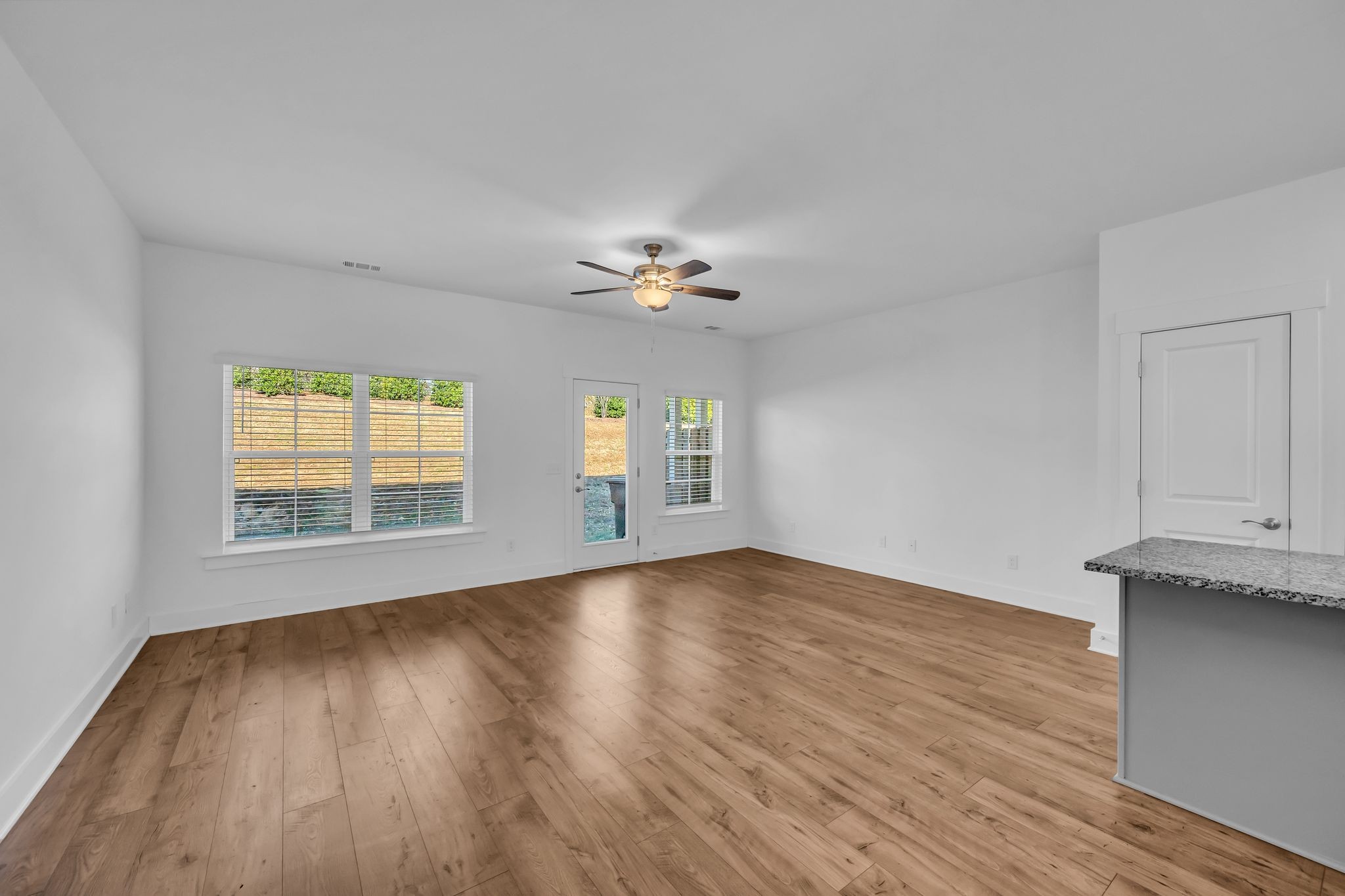 7144 Gracious Drive Franklin, TN 37064 - Photo 11 of 28 a view of an empty room with a window and wooden floor