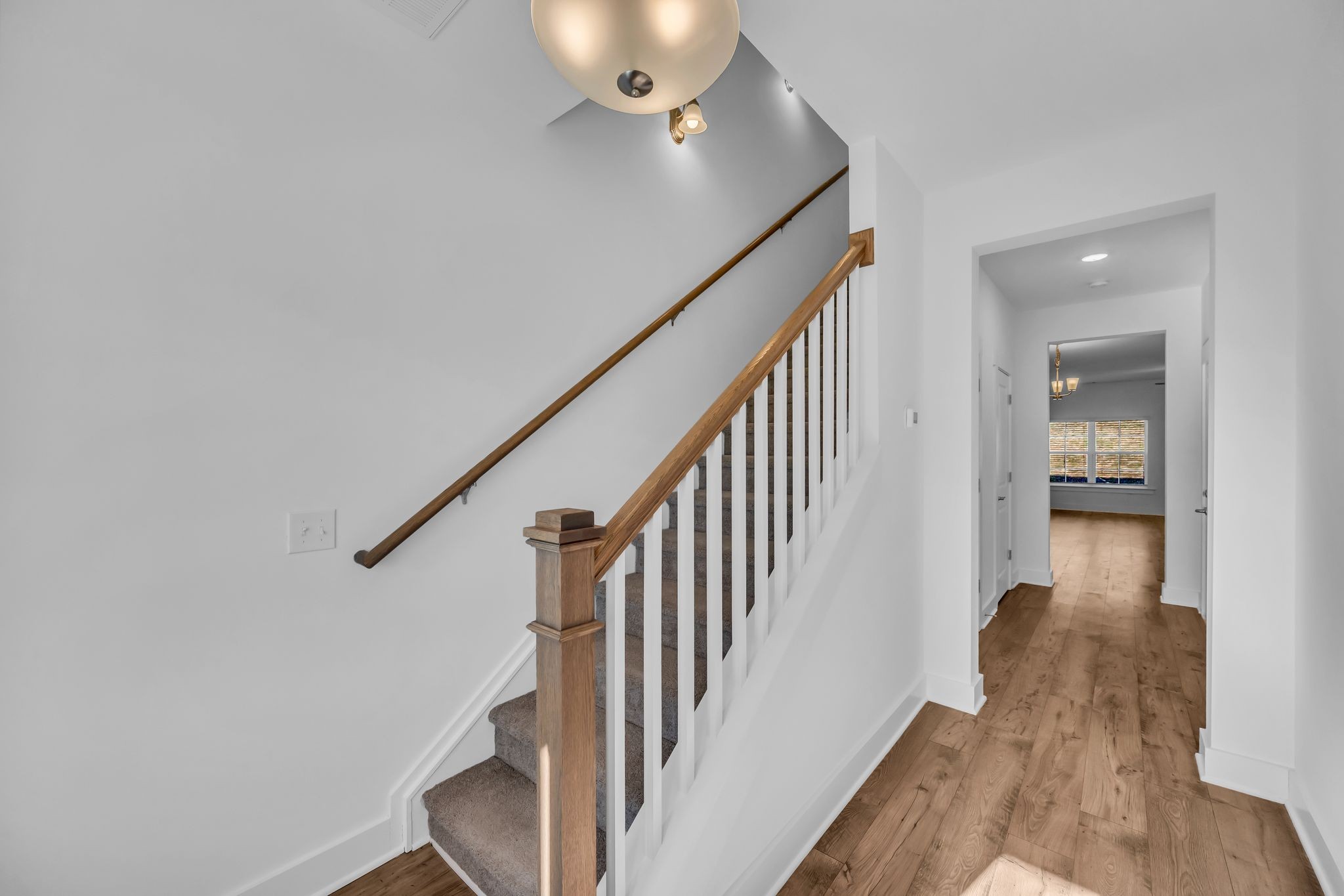7144 Gracious Drive Franklin, TN 37064 - Photo 4 of 28 a view of a hallway with wooden floor and staircase