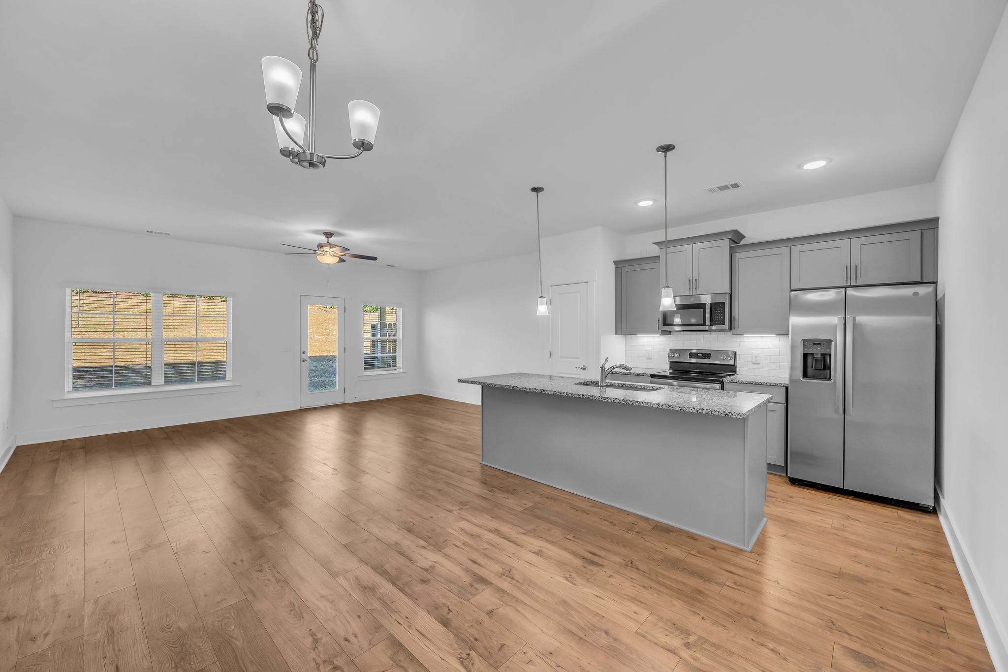 7144 Gracious Drive Franklin, TN 37064 - Photo 6 of 28 a view of kitchen with sink microwave and refrigerator