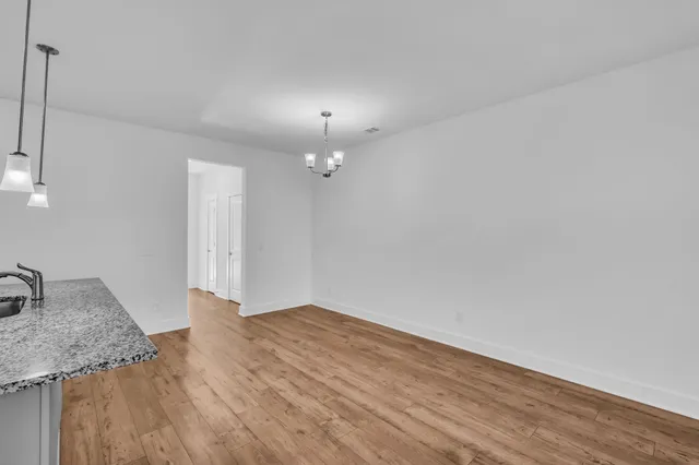 a view of a kitchen counter space and a sink