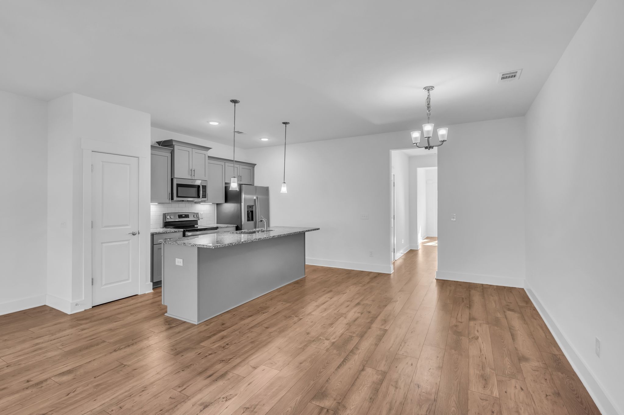 7144 Gracious Drive Franklin, TN 37064 - Photo 8 of 28 a view of kitchen with refrigerator microwave and wooden floor