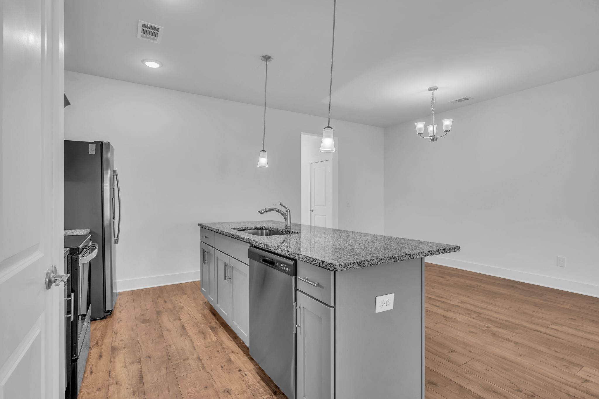 7144 Gracious Drive Franklin, TN 37064 - Photo 9 of 28 a kitchen with stainless steel appliances granite countertop a stove a refrigerator and a sink