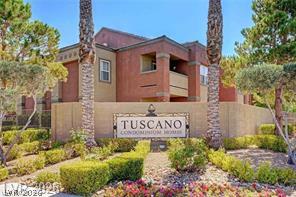 7255 West Sunset Road, Unit 2164 Las Vegas, NV 89113 - Photo 1 of 16 Palm trees and manicured shrubbery frame the prominent community entryway sign.