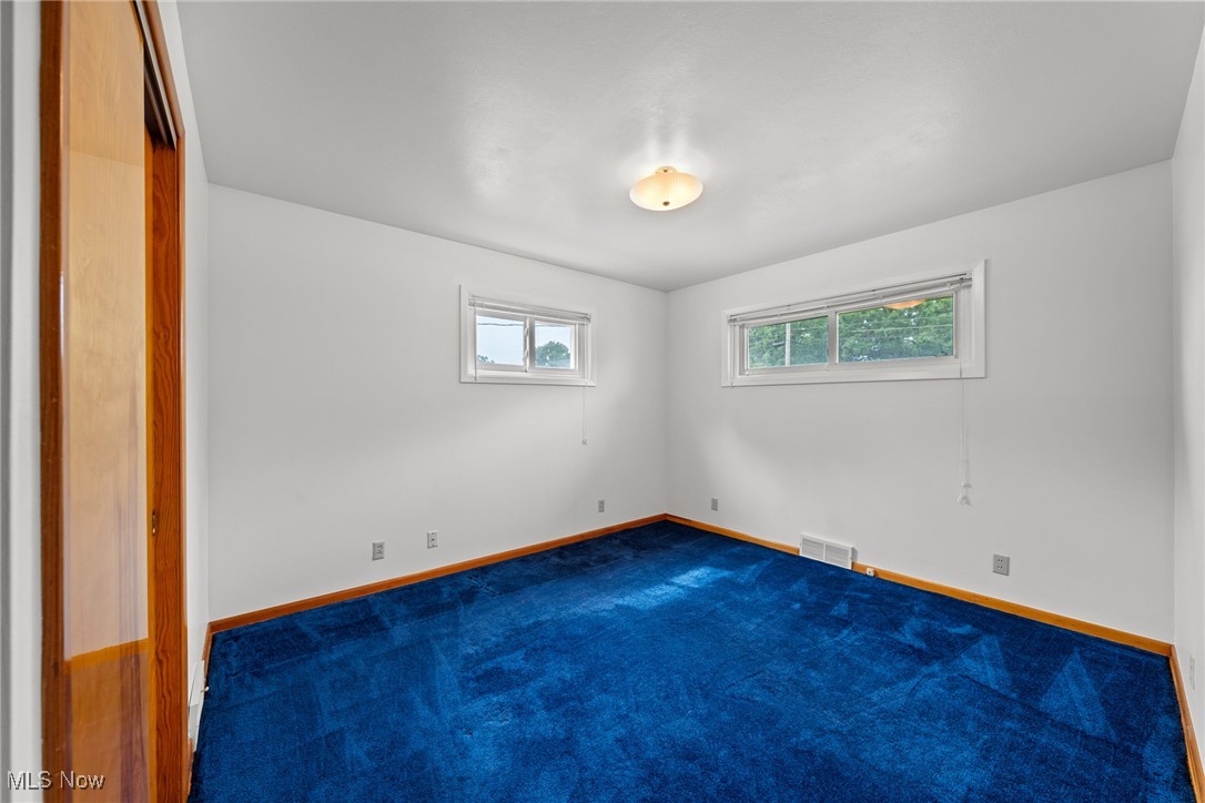 29776 Arthur Road Wickliffe, OH 44092 - Photo 18 of 49 Unfurnished room with dark carpet and baseboards