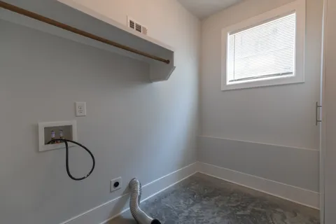 a bathroom with a tub and a window