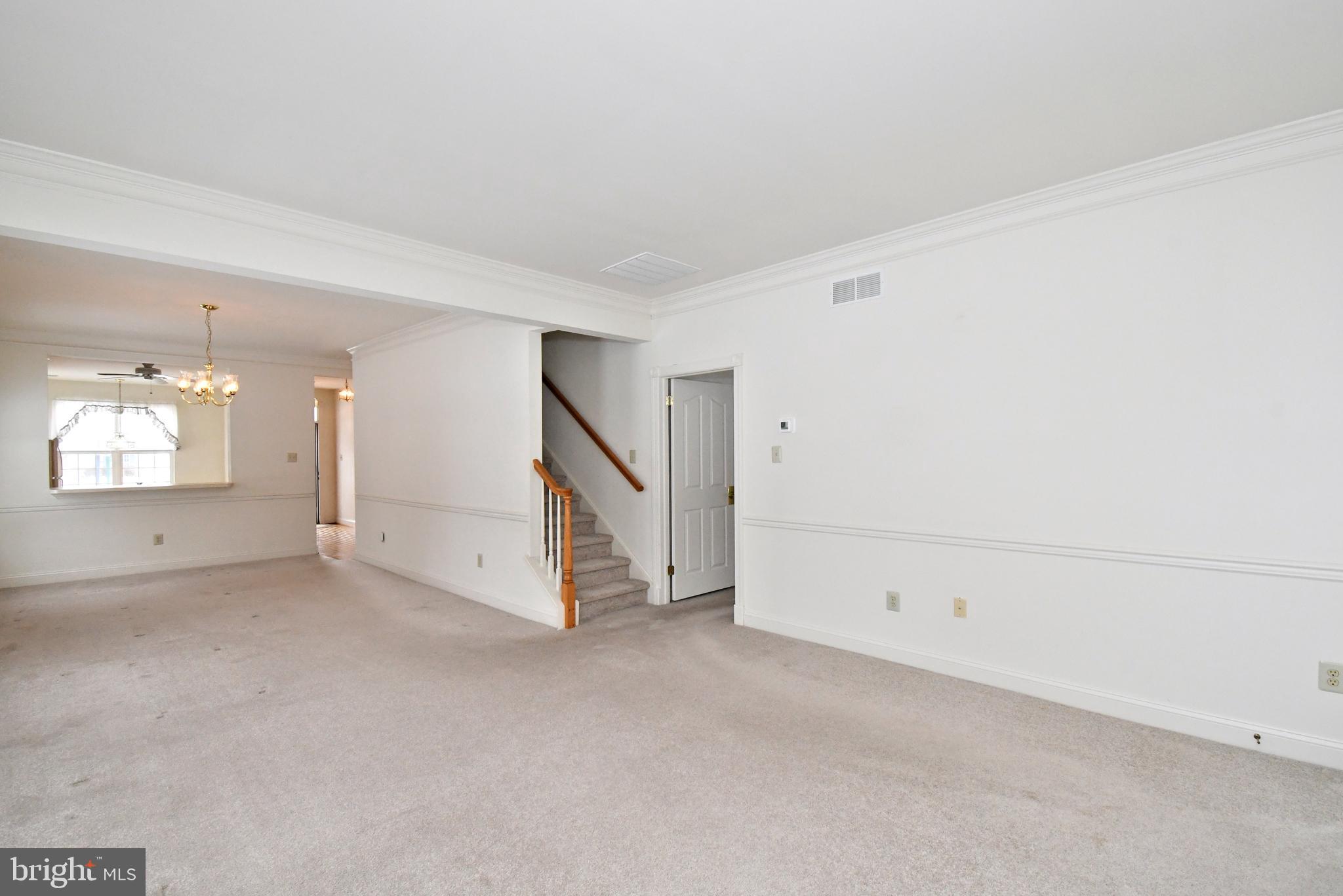 425 Ruth Court Harleysville, PA 19438 - Photo 4 of 26 an empty room with white walls and white walls